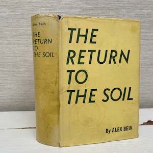 May include: A yellow book with the title "The Return to the Soil" by Alex Bein. The title is in green text.