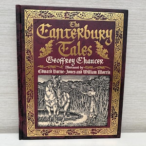 May include: A hardcover book titled "The Canterbury Tales" by Geoffrey Chaucer, illustrated by Edward Burne-Jones and William Morris. The cover is burgundy with gold lettering and a detailed illustration.