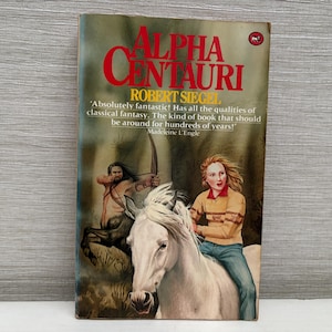 May include: A vintage paperback book titled "Alpha Centauri" by Robert Siegel. The cover art features a centaur with a bow and arrow, a woman riding a white horse, and the book's title in large red letters. The book is a work of classical fantasy.