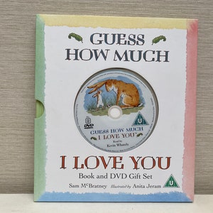 May include: A book and DVD gift set featuring the children's book "Guess How Much I Love You" by Sam McBratney. The cover of the book features a brown bunny and a smaller brown bunny. The DVD features a U rating and the text "Guess How Much I Love You" with the words "Read by Kevin Whately".