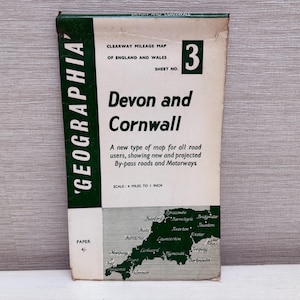 May include: Vintage "Geographia" map of Devon and Cornwall, Sheet No. 3. The cover features a green and white design with the title and a map of the region. The scale is 4 miles to 1 inch.