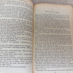 May include: Open book with text on aged paper. The pages display printed text, with the words "STEVENSON" and "The room in the Chapel" visible. The book is open to a double-page spread.