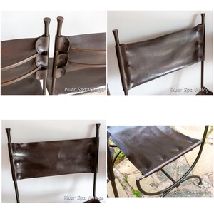 May include: Two brown leather chairs with metal frames. The chairs have a simple design with a single back panel and a curved seat. The chairs are made of dark brown leather and have a rustic look.