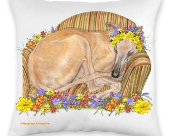 May include: A tan colored Greyhound dog wearing a flower crown is sleeping in a striped armchair. The armchair is surrounded by a variety of colorful flowers.