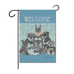 May include: A blue welcome garden flag with a group of miniature schnauzers in various poses. The flag has a decorative floral pattern in the background.