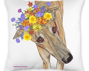 May include: A brown and white Greyhound dog wearing a flower crown with yellow, orange, red, and purple flowers. The dog is looking at the camera with its head tilted to the side.