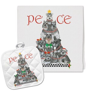 May include: A white kitchen towel and matching pot holder with a Christmas tree design featuring a group of miniature schnauzers. The text "peace" is written in red on both items.