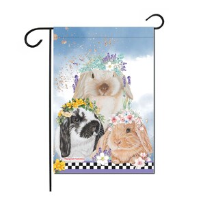 May include: Three bunnies wearing flower crowns. The bunnies are white with brown spots, black and white, and brown. The background is a blue sky with white clouds and gold glitter.