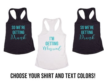 May include: Three tank tops with different text. One says "So we're getting drunk", another says "I'm getting married", and the third says "So we're getting drunk".