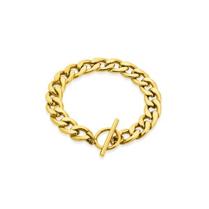 Peut inclure: Un bracelet chaîne doré avec un fermoir à glissière.