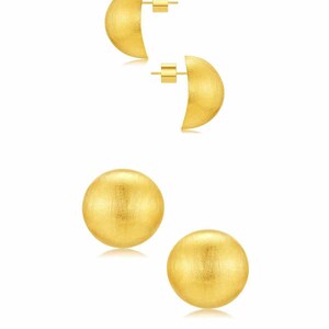 gold dome earrings on white banckground