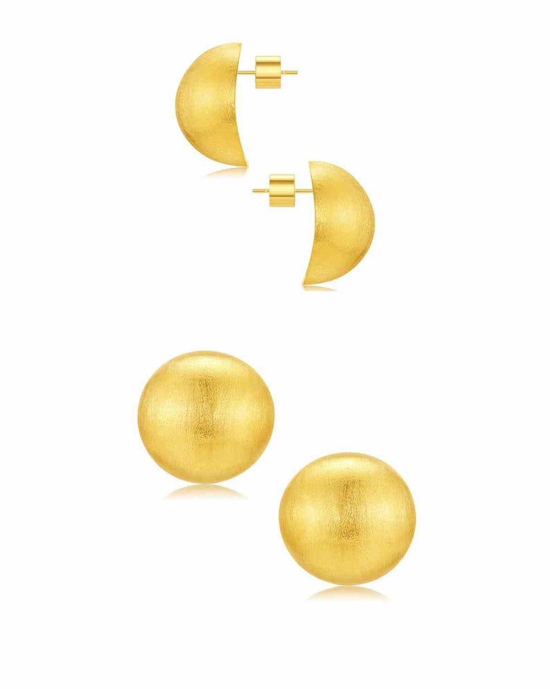 gold dome earrings on white banckground