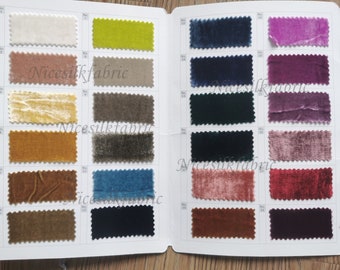 May include: A fabric swatch book displaying 24 different colours of velvet fabric. The swatches are arranged in two rows of 12. The fabric is a soft, luxurious material ideal for upholstery, clothing, and accessories.