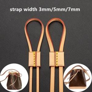 May include: Two brown leather straps with yellow stitching and a buckle. The straps are 3mm, 5mm, and 7mm wide. The straps are shown with a brown leather bucket bag with a drawstring closure.
