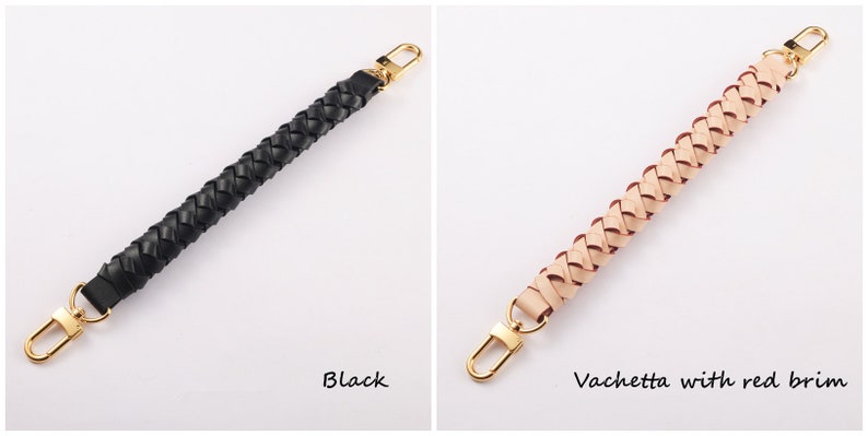 May include: Two braided leather handbag straps with gold clasps. The strap on the left is black. The strap on the right is a light beige color with red stitching. The text "Black" is below the left strap and the text "Vachetta with red brim" is below the right strap.
