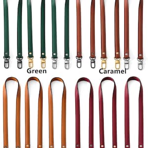 May include: A collection of leather bag straps in various colors, including green, caramel, coffee, and wine red. Each strap has metal swivel clasps for easy attachment. The word "Green", "Caramel", "Coffee", and "Wine Red" are printed below each color.