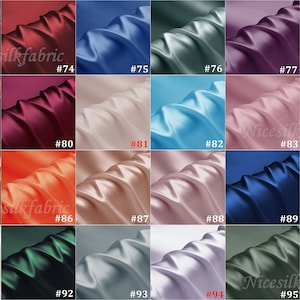 May include: A collection of 16 fabric swatches in various colors, including red, blue, green, orange, and white. Each swatch is labeled with a number from 73 to 96. The fabric appears to be satin.