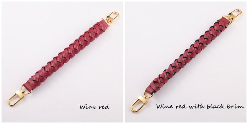 May include: Two braided leather handbag straps with gold metal clasps. The strap on the left is wine red. The strap on the right is wine red with a black trim.