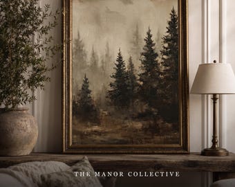 May include: A framed landscape painting depicting a dark, misty forest with tall evergreen trees in shades of brown, black, and muted gray. The artwork is enclosed in an ornate, dark gold frame and features the text THE MANOR COLLECTIVE at the bottom.