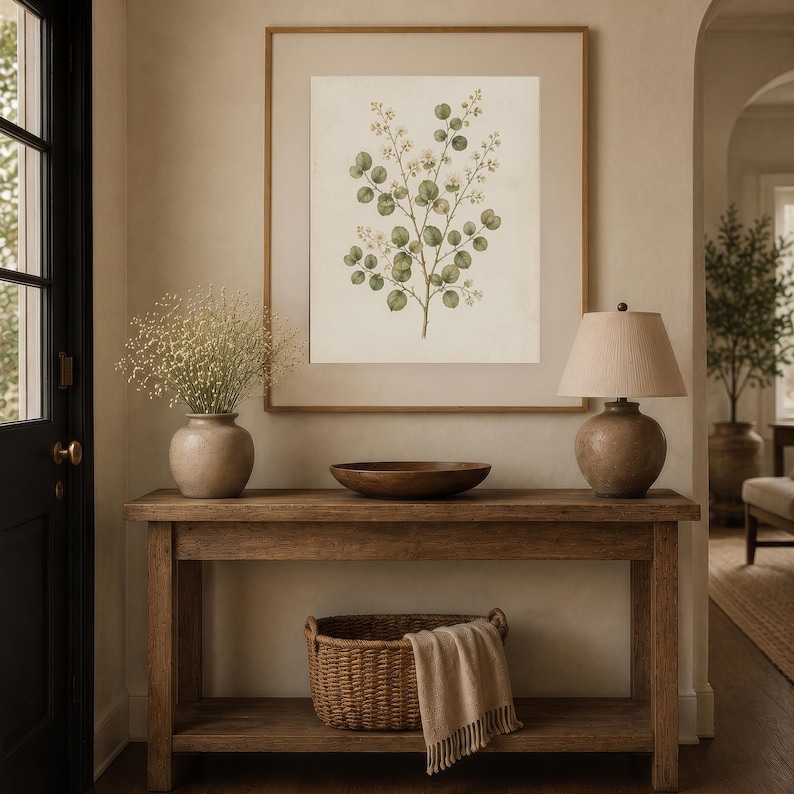 Neutral botanical wall art creating an elegant gallery wall in a classic living room with vintage decor.