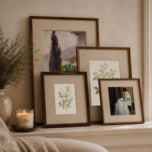 Vintage botanical wall art set of 2 featuring antique floral illustrations in neutral tones, styled in a French country living room.