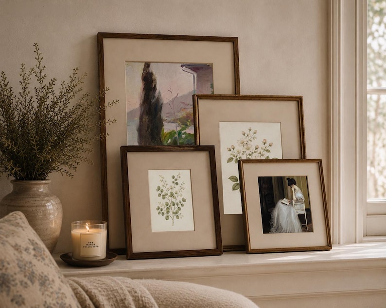 Vintage botanical wall art set of 2 featuring antique floral illustrations in neutral tones, styled in a French country living room.