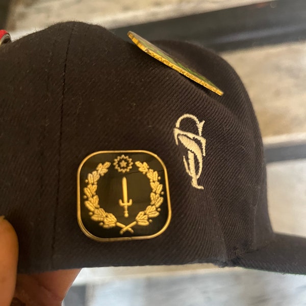 Black Heritage Crest lapel pin.