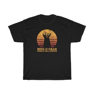 Hide And Grab World Champions - Tremors - Graboids - Creature Feature - Horror Movie - Unisex Heavy Cotton Tee