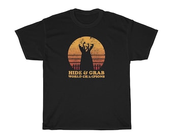Hide And Grab World Champions - Tremors - Graboids - Creature Feature - Horror Movie - Unisex Heavy Cotton Tee