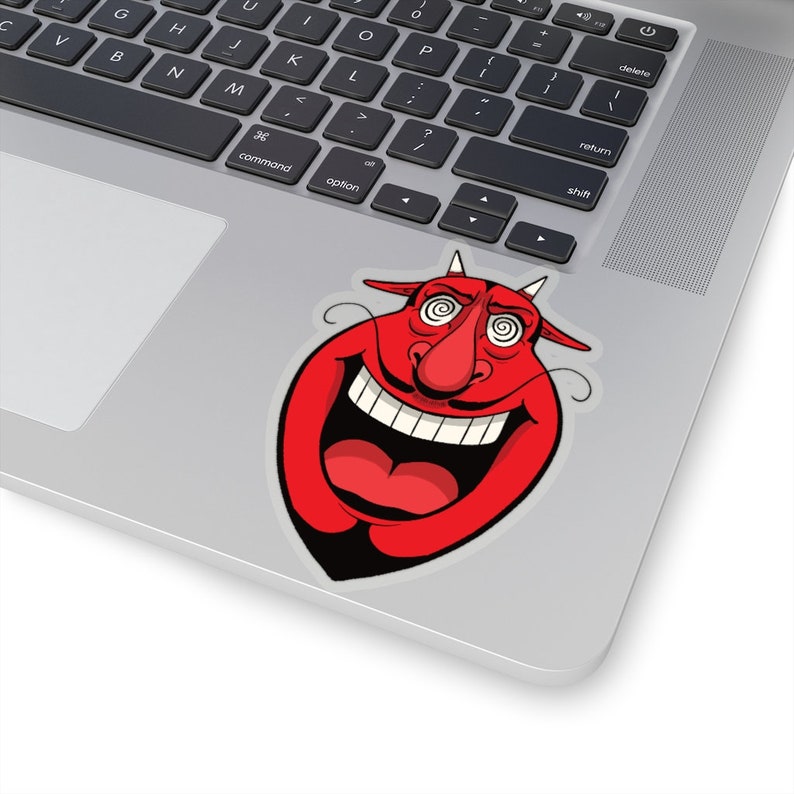 K&ouml;nnte beinhalten: Ein roter Cartoon-Teufel mit einem breiten, zahnigen Grinsen und wirbelnden Augen. Der Teufel hat eine gro&szlig;e, runde Nase und H&ouml;rner.