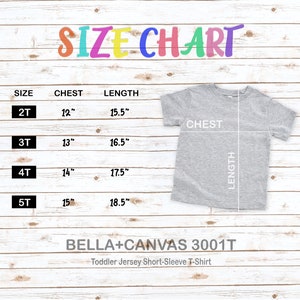 May include: A size chart for a toddler short-sleeve t-shirt, with measurements in inches. The chart includes sizes 2T, 3T, 4T, and 5T, with chest and length dimensions. The shirt is gray, and the text "SIZE CHART" is at the top.