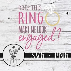 May include: Does this ring make me look engaged? SVG and PNG digital download files. The text is in pink and the ring is gold with a white diamond. The background is a white wood plank.