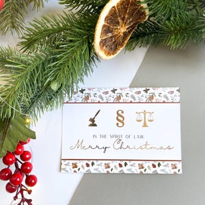 Christmas card – with legal symbols, paragraph sign, scales of justice, gift for jurists.