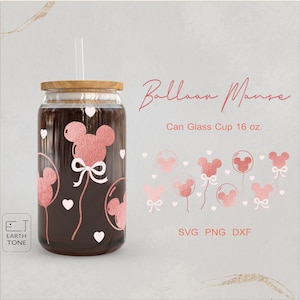 May include: A 16 oz. glass can cup with a straw and a pink Mickey Mouse balloon design. The design features Mickey Mouse ears and a bow. The text "Balloon Mouse" and "Can Glass Cup 16 oz." are also included in the image. The text "SVG PNG DXF" is at the bottom of the image.