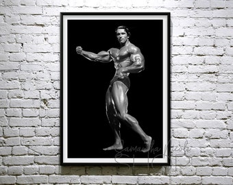 May include: Black and white photograph of a bodybuilder posing with his arms flexed. The bodybuilder is wearing a black posing suit and is standing against a black background.