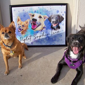May include: A framed watercolor portrait featuring three dogs with the names "Piglet Sophie Luca" in script. A brown dog with a blue collar sits to the left, and a black dog with a purple harness is on the right. The background is a blue watercolor wash.