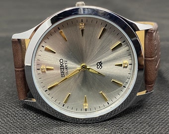 Seiko Quartz 36 mm case Round shape Japanese Silver dial Men's Wrist watch