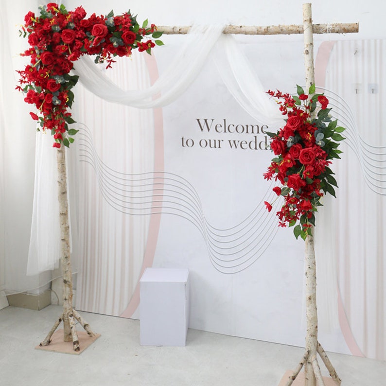 All White Wedding Flowers with Arch as Pop of Red Cllor 1
