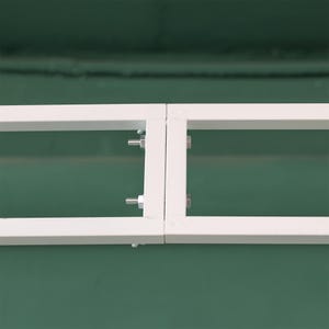 May include: Two white metal frames joined together with screws. The frames are rectangular and have a simple design.
