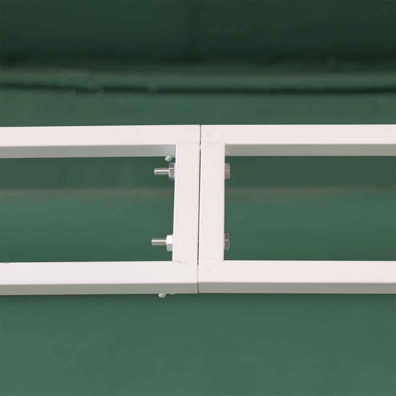 May include: Two white metal frames joined together with screws. The frames are rectangular and have a simple design.
