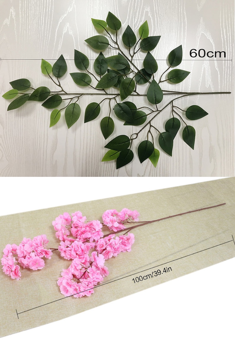 Pu&ograve; includere: Due rami di fiori artificiali con fiori rosa e foglie verdi. I rami sono lunghi 60 cm e 100 cm.
