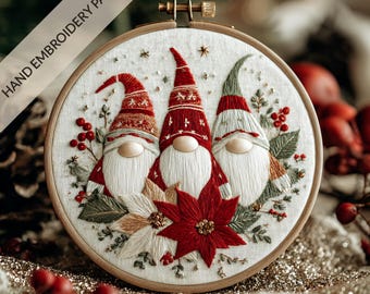 May include: Hand-embroidered Christmas gnome pattern in a wooden hoop. The design features three gnomes with red and green hats, long white beards, and a poinsettia flower. The text "HAND EMBROIDERY PATTERN" is visible.