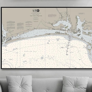 May include: A nautical chart of Cape Lookout to Bogue Inlet, North Carolina. The chart is printed in black and white on a white background and shows the coastline, inlets, and waterways of the area. The chart is framed in a black frame.