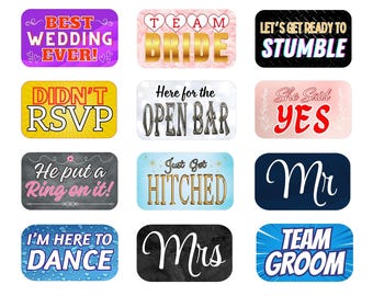 May include: A collection of colorful photo booth props with various phrases for weddings and parties. The props include phrases like "Best Wedding Ever!", "Team Bride", "Open Bar", "Mr", and "Team Groom".