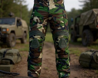 May include: Camouflage cargo pants with green knee pads. The pants feature a woodland camouflage pattern in shades of green, brown, and beige. Multiple pockets are visible on the sides and legs. The pants are designed for outdoor activities.