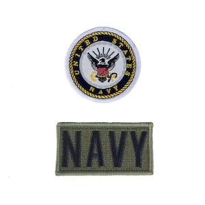 May include: Two embroidered patches. The top patch is round with a white border, a blue ring with text, and a central emblem. The bottom patch is rectangular with the word "NAVY" in dark green.