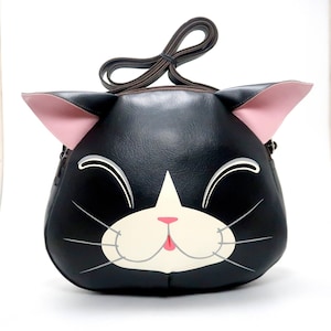 Sac à bandoulière chat noir souriant, peint à la main, ce sac à bandoulière compact en cuir synthétique, pour transporter des téléphones portables et d'autres objets essentiels.