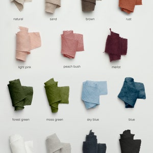 May include: A collection of 14 fabric swatches in various colors, including natural, sand, brown, rust, light pink, peach bush, merlot, forest green, moss green, sky blue, blue, white, cloud grey, graphite, and black.