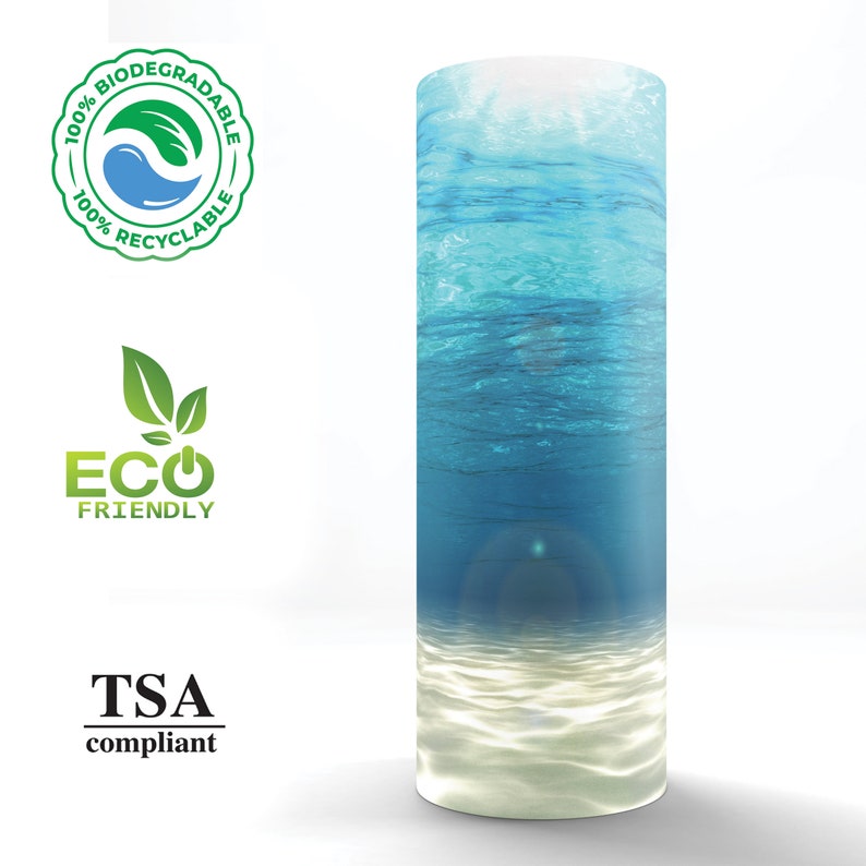 May include: A blue and white tumbler with an ocean scene. The tumbler is made from 100% biodegradable and recyclable materials. It is also TSA compliant and eco-friendly.