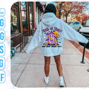 May include: A light blue hoodie with a graphic of a purple house with the text "Trick or Treat" and "Need more square feet?" printed on the back.